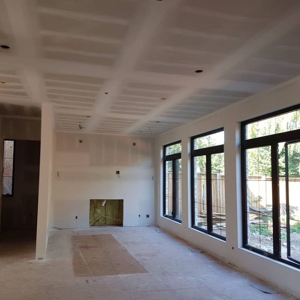 amazing family room drywall in custom home - putting up drywall